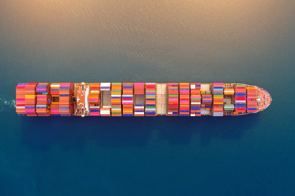Cargo containers beside open water